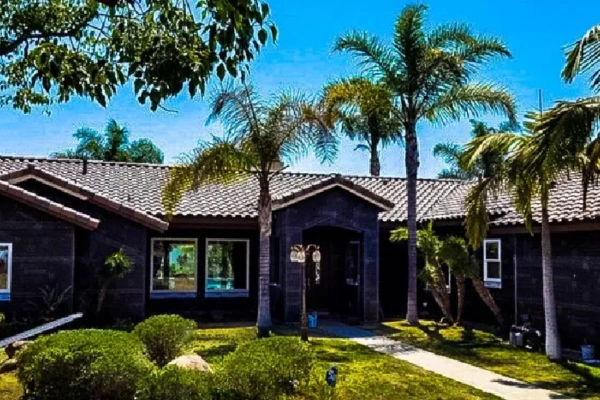 Residential roofing project in San Diego featuring tile roof installation on suburban home