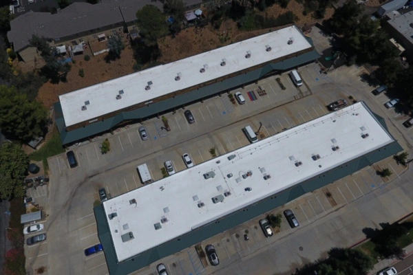 Aerial view of commercial roofing system in San Diego on industrial building